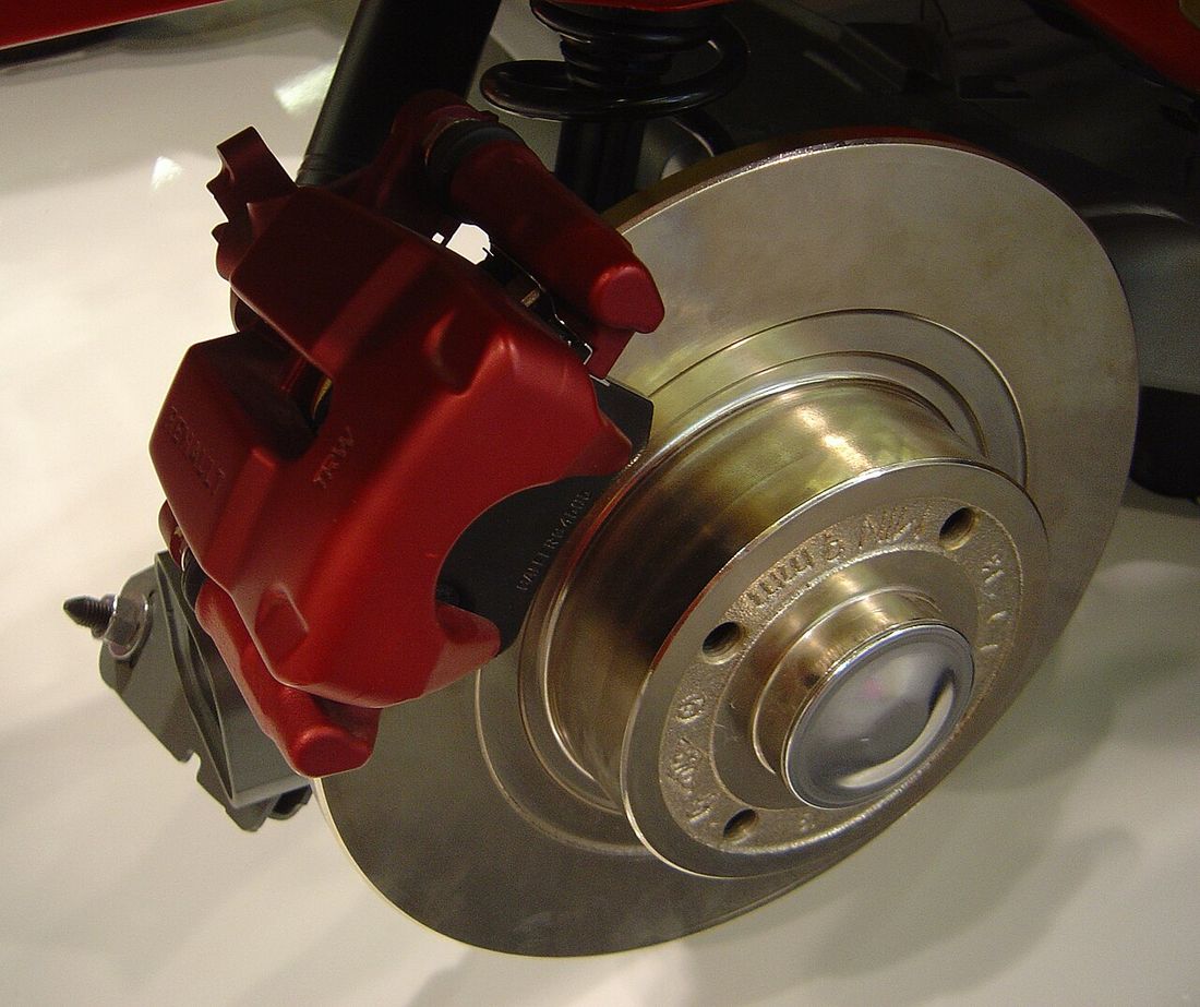 A ventilated brake disc and caliper assembly shown in detail
