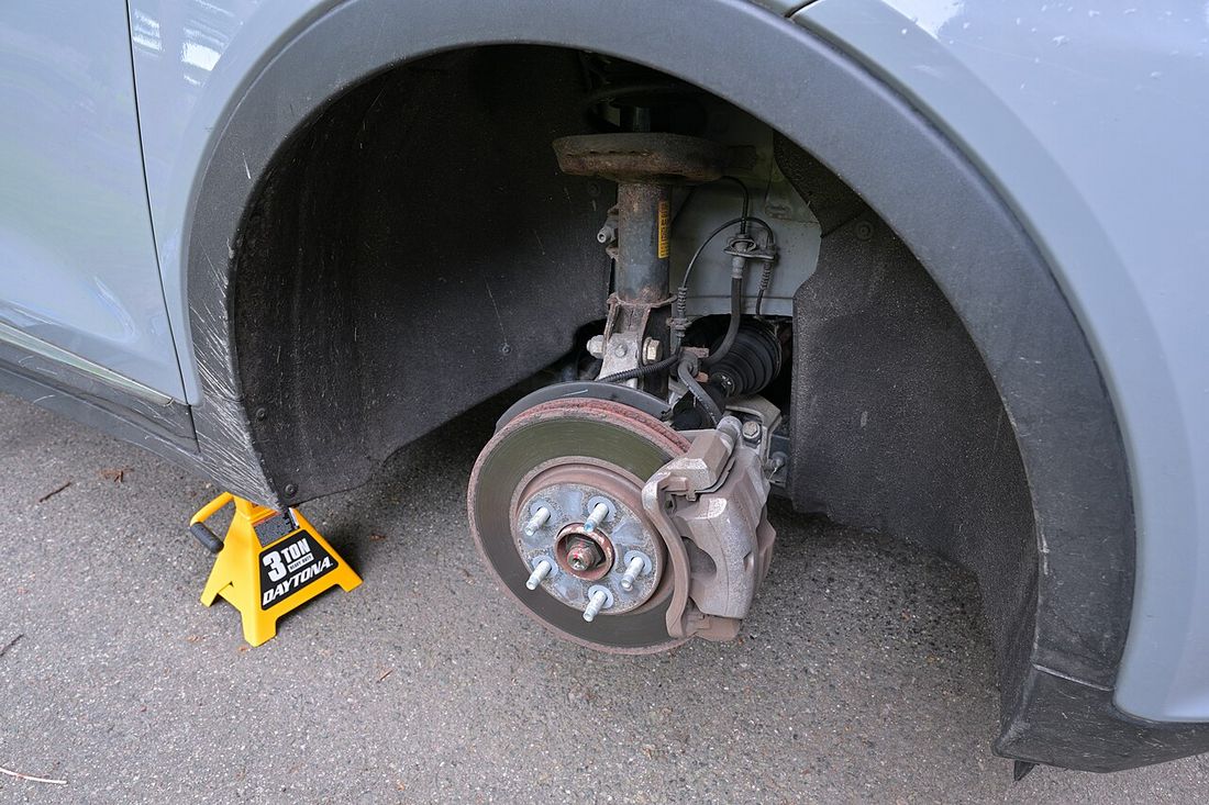 Another view of a car disc brake showing the caliper and mounting