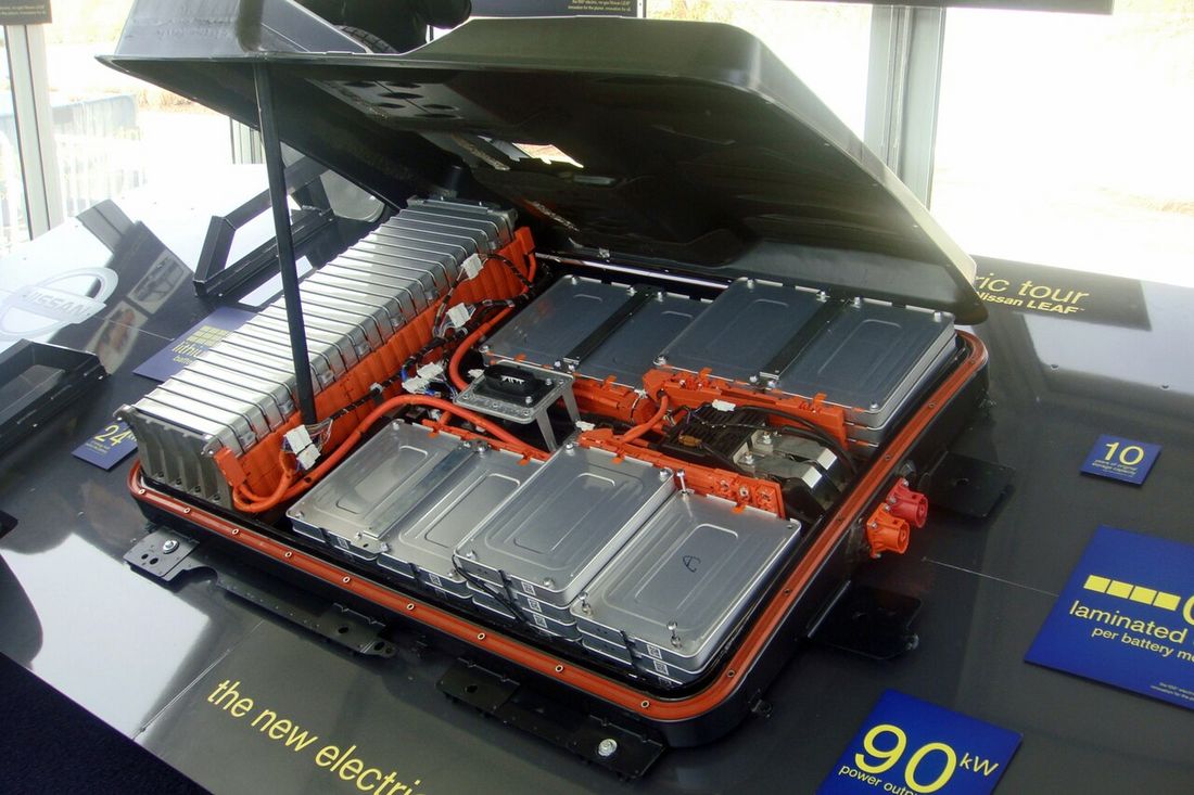A flat electric car battery pack removed from a car and shown from above