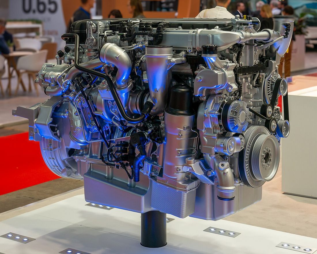 A large modern diesel truck engine in bright blue