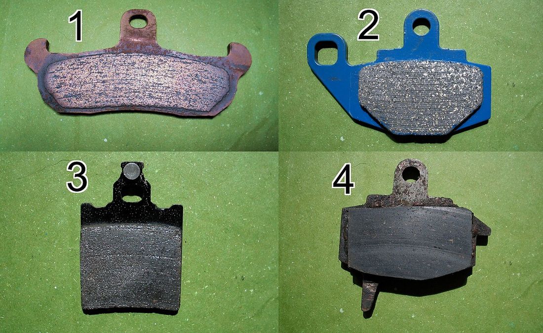 A set of car brake pads, the usual source of a braking squeal